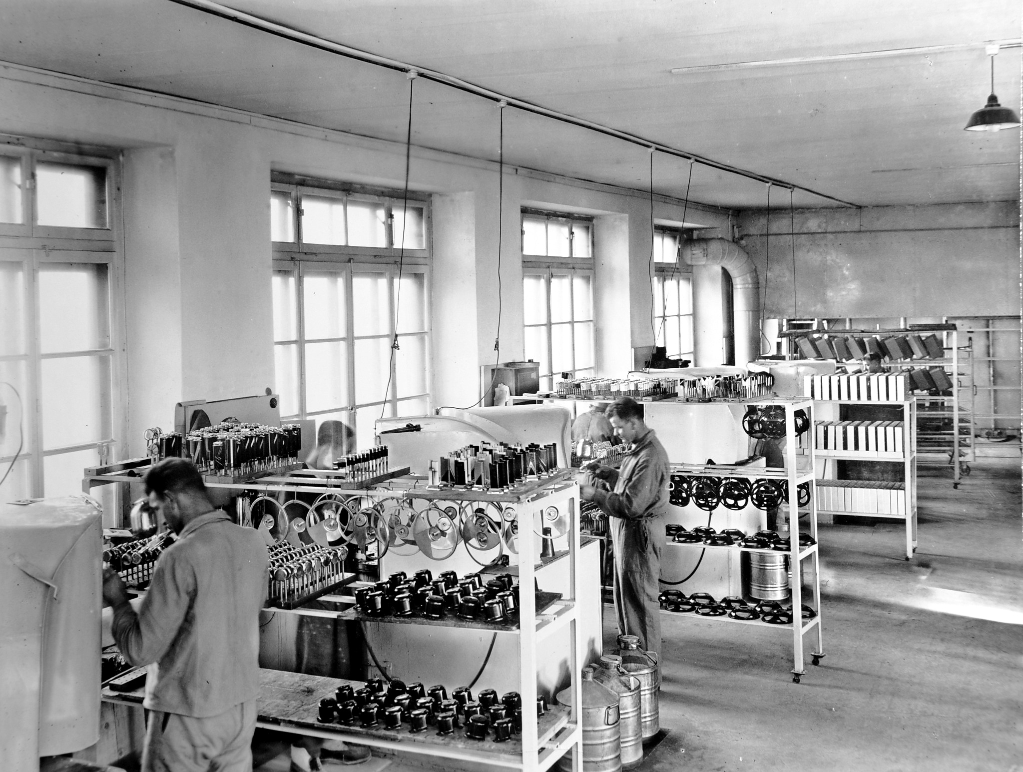 Historic Thorens workshop with workers and production machinery